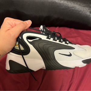 Good condition - Women’s Nike zoom sneakers black and white. Worn a few times